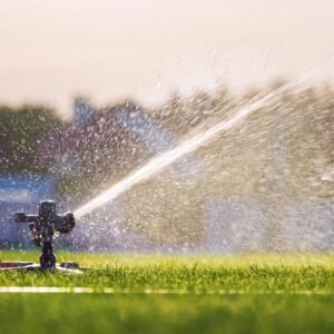 automatic-lawn-sprinkler-watering-green-grass-stadium-irrigation-system